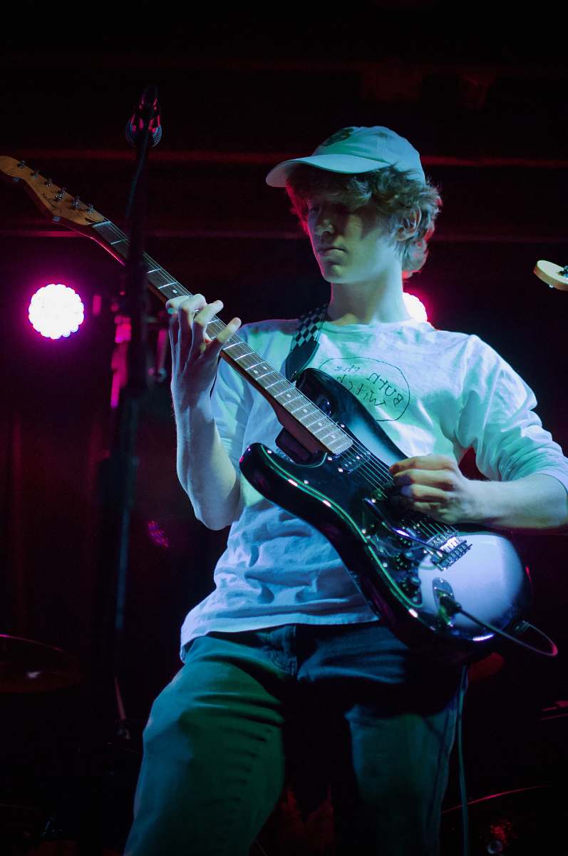 musical instrument man in white dress shirt playing electric guitar guitar